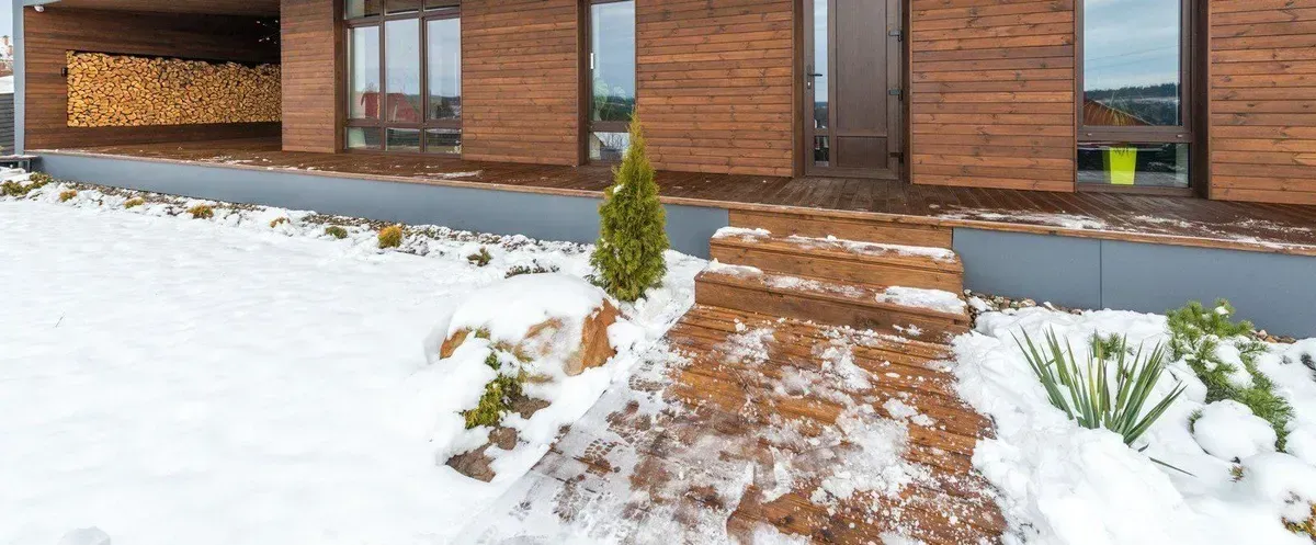 Cleared path to an Oakville front door with snow banked on both sides